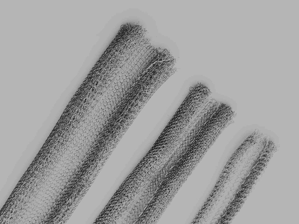 Knitted wire mesh for EMI shielding and industrial sealing applications