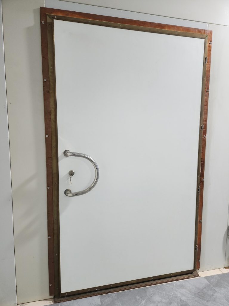 Shielded door with multiple opening and unlocking options for EMI-protected enclosures